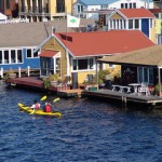 Kayakers amongst the houseboats